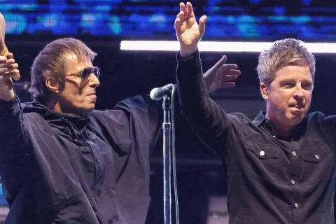 FILE PHOTO: Liam Gallagher and Noel Gallagher from the British rock band Oasis, react during their Oasis Live '25 Tour at the Rose Bowl Stadium in Pasadena, California, U.S., September 6, 2025. REUTERS/Mario Anzuoni/File Photo ORG XMIT: FW1
