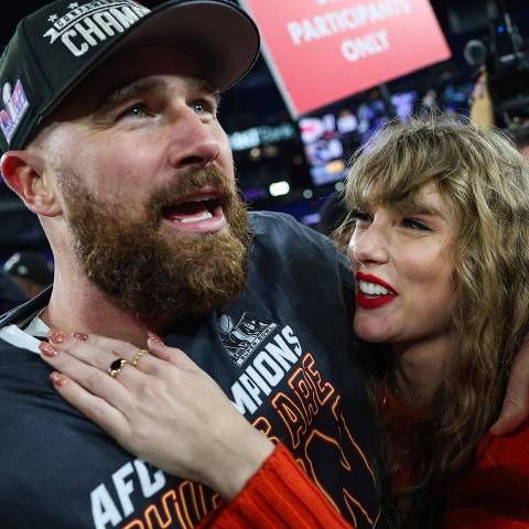(FILES) Travis Kelce #87 of the Kansas City Chiefs (L) celebrates with Taylor Swift after defeating the Baltimore Ravens in the AFC Championship Game at M&T Bank Stadium on January 28, 2024 in Baltimore, Maryland. Pop superstar Taylor Swift and American football player Travis Kelce announced their engagement on August 26, 2025, setting the stage for a high-profile wedding for the celebrity couple. A joint post on their Instagram pages showed pictures of Kelce on one knee making his marriage proposal in a flower-laden garden, and then Swift, 35, displaying a large diamond ring. (Photo by Patrick Smith / GETTY IMAGES NORTH AMERICA / AFP)